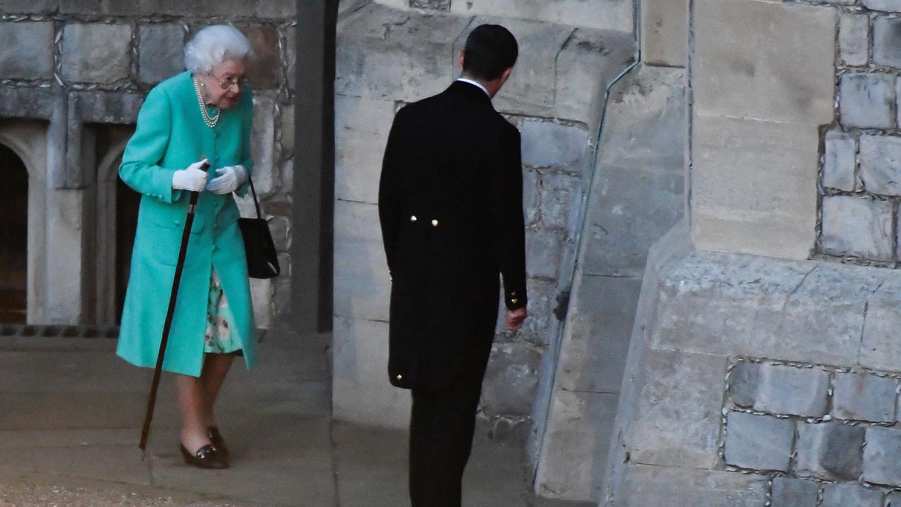 Queen Elizabeth appears to struggle to walk after attending a ceremony to start the lighting of the Principal Beacon outside of Buckingham Palace in London on June 2, 2022. Picture: TOBY MELVILLE / POOL / AFP.