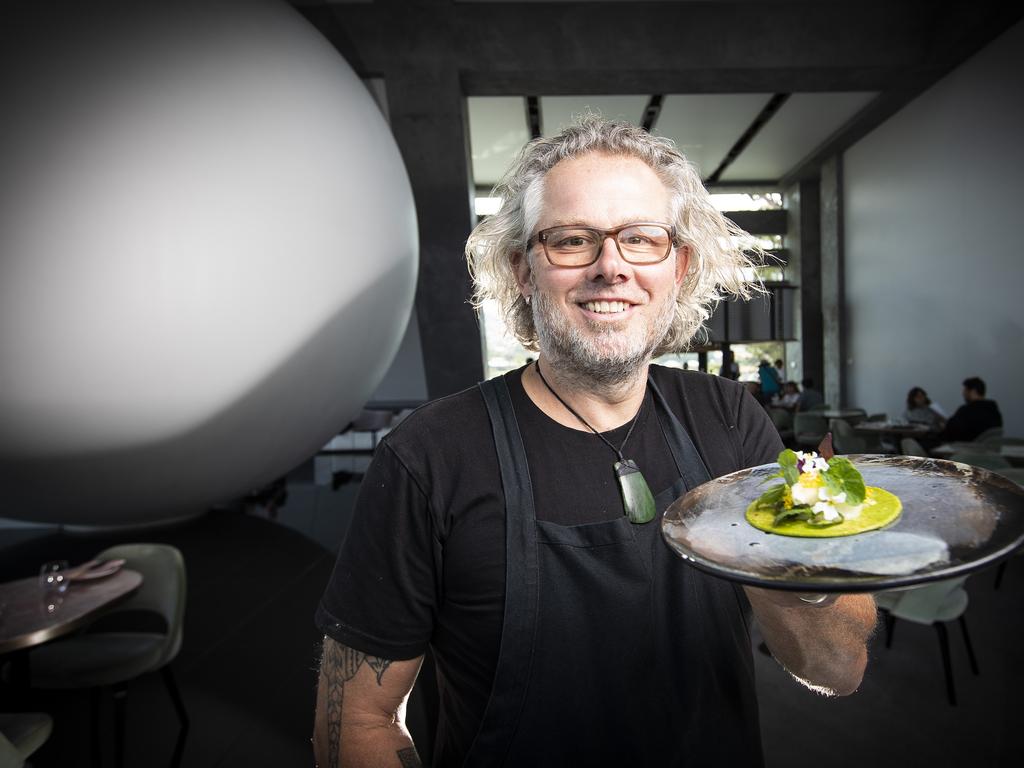 Executive Chef of Mona Vince Trim at Faro restaurant with a scallop taco and black margarita with pig's eye. Picture: LUKE BOWDEN