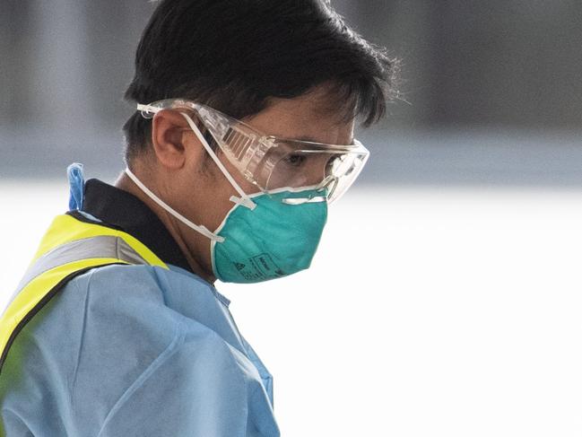 SYDNEY, AUSTRALIA - NewsWire Photos October 8, 2020: Health workers administering a test for COVID-19 at a drive through testing centre in North Ryde, Sydney. Picture: NCA NewsWire / James Gourley