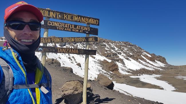 Steve Plain reaches the summit of Mount Kilimanjaro.