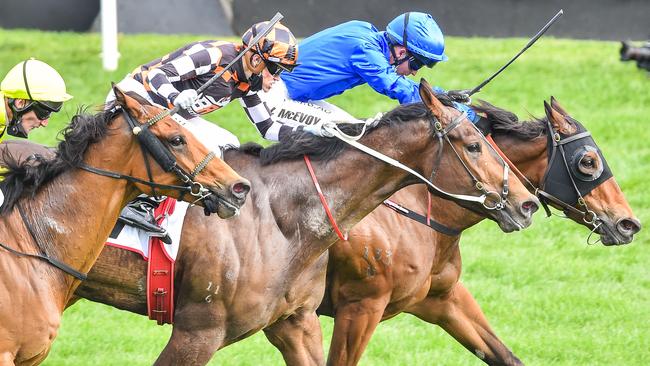 Kerrin McEvoy, blue, winning the MSS Security Sprint at Flemington Racecourse on Tuesday. Picture: Getty Images