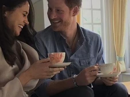 Meghan Markle giggles as she sips tea with Prince Harry in the late Queen's childhood playhouse.