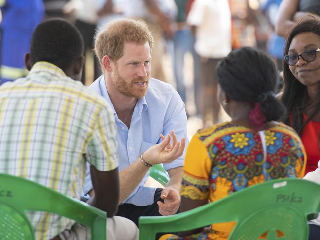 Prince Harry takes part in a discussion with young people during a visit to the Mauwa Health Centre in Blantyre, Malawi. Picture: AP