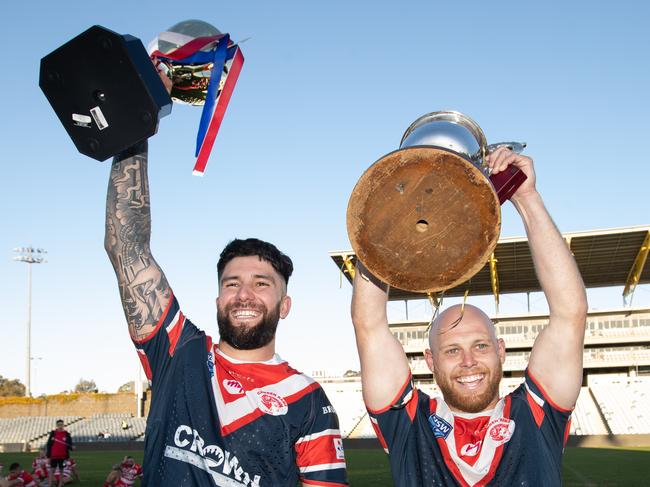 (L-R) Mason Cerruto and Brad Speechley celebrate Camden’s 2022 grand final victory. Pic by Julian Andrews.