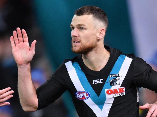 Robbie Gray celebrates a goal with Todd Marshall of the Power during the Round 13 AFL match between the Port Adelaide Power and the Western Bulldogs at Adelaide Oval in Adelaide, Thursday, June 14, 2018. (AAP Image/David Mariuz) NO ARCHIVING, EDITORIAL USE ONLY