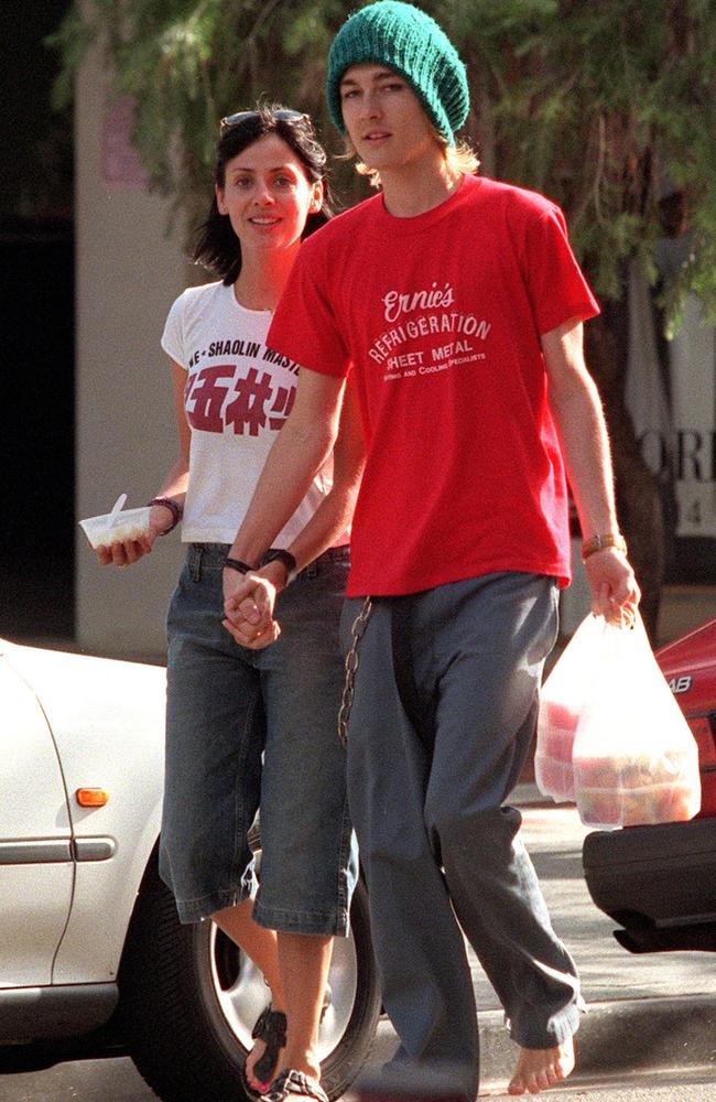 2000: Johns and singer Natalie Imbruglia with Chinese takeaway food as the then-couple return to their Double Bay hotel.