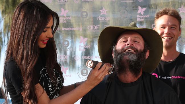 Chris has his beard shaved off by Chloe Paperella from Oscar Oscar salons. Picture: Glenn Hampson.