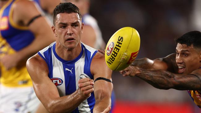 MELBOURNE . 18/03/2023.  AFL Round 1.  North Melbourne vs West Coast Eagles at Marvel Stadium.   Luke Davies-Uniacke of the Kangaroos clears by hand during the 1st qtr.   . Pic: Michael Klein