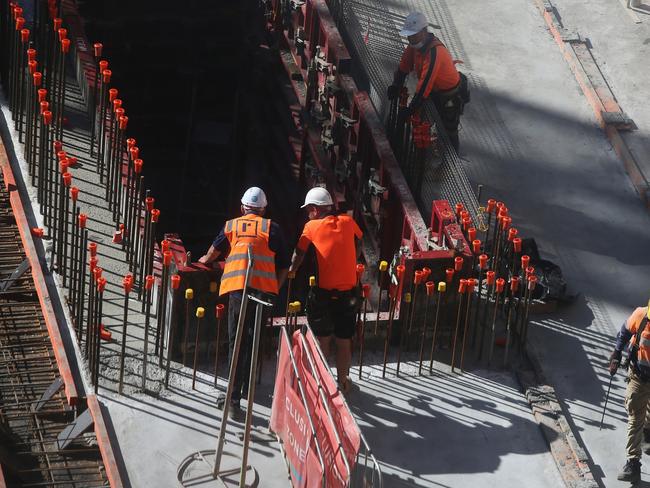 Construction workers labor at a construction site in the central business district (CBD) of Sydney, Australia, on Tuesday, Sept. 28, 2021. Australian household spending declined for a third consecutive month as the delta variant of coronavirus swept the east coast and nations largest cities. Photographer: Lisa Maree Williams/Bloomberg via Getty Images sydney construction