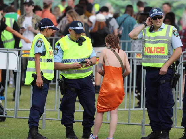 Police check identification outside the Listen Out Music Festival at Centennial Park.