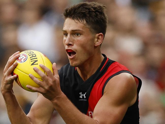 MELBOURNE, AUSTRALIA - MARCH 19: Archie Perkins of the Bombers in action during the round one AFL match between Hawthorn Hawks and Essendon Bombers at Melbourne Cricket Ground, on March 19, 2023, in Melbourne, Australia. (Photo by Jonathan DiMaggio/AFL Photos/via Getty Images)