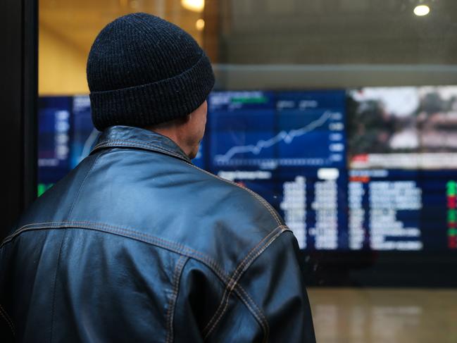 SYDNEY, AUSTRALIA - NewsWire Photos JULY 05, 2021: A member of the public is seen checking the stocks at the ASX in the CBD, as we enter week 2 of Covid-19  lockdown in Sydney Australia. Picture: NCA NewsWire / Gaye Gerard