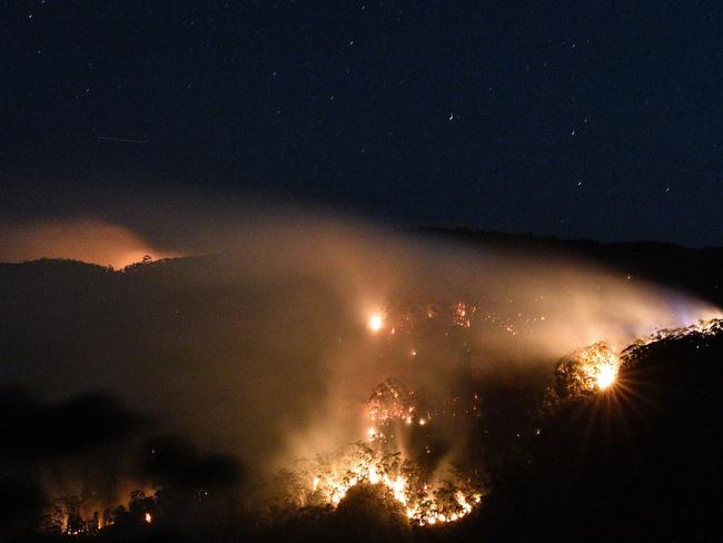 A bushfire burns out of control in the Blue Mountains on Monday. Picture: Saeed Khan/AFP