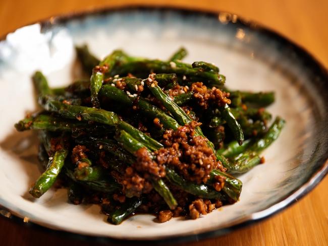 The green beans with minced pork dish features crisp-tender fried beans and just enough pork and chilli to give it a punch of flavour. Picture: MIREILLE MERLET