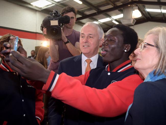 Australian Prime Minister Malcolm Turnbull takes a selfie with work experience student Godfrey Kenyi during a youth employment forum in Perth. Mr Turnbull is today campaigning in Western Australia. (AAP Image/Lukas Coch)