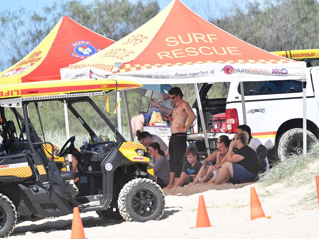 Family and friends wait near the entrance of Stumers Creek. Picture: Patrick Woods.