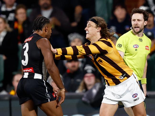 Isaac Quaynor and Jack Ginnivan of the Hawks clash during the Pies’ win over the Hawks. The pair had dinner during the week. Picture: Michael Willson/AFL Photos via Getty Images.