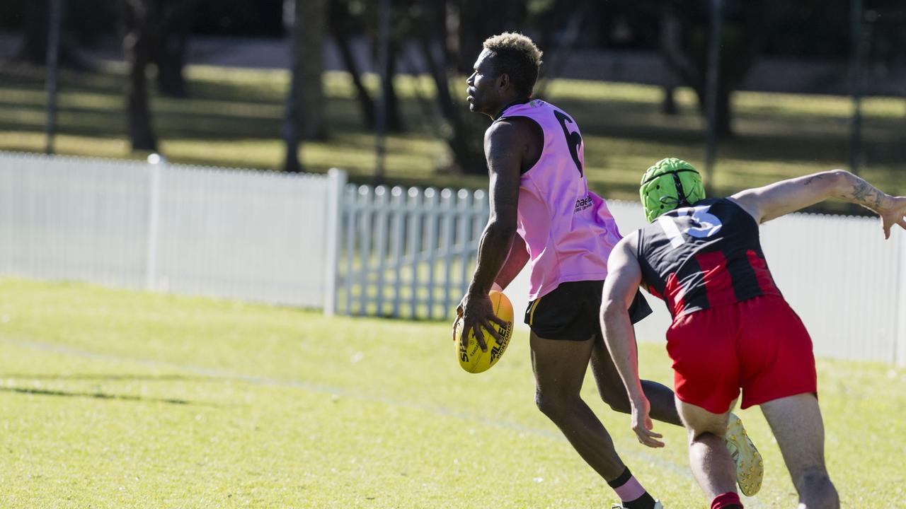 Laurie Logo of Toowoomba Tigers looks to get away from Jackson Montgomery of South Toowoomba Bombers. Picture: Kevin Farmer