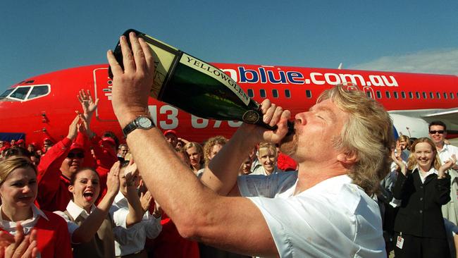 Richard Branson drinking champagne at Virgin’s launch in 2000.