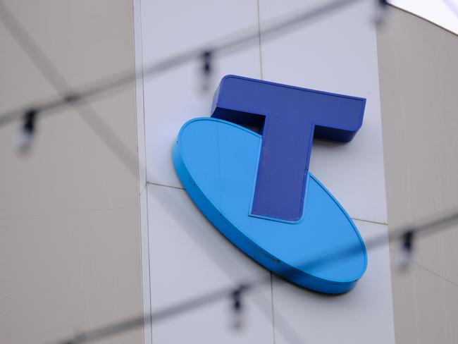 MELBOURNE, AUSTRALIA - NewsWire Photos OCTOBER 4, 2022. Generic photo people walking past the Telstra logo in Melbourne..Picture: NCA NewsWire / Luis Enrique Ascui