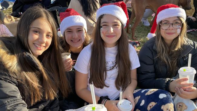 Year 8 Our Lady Of Sion friends Alexis, Anna, Stephanie and Ebony at Manningham's 2022 Carols.