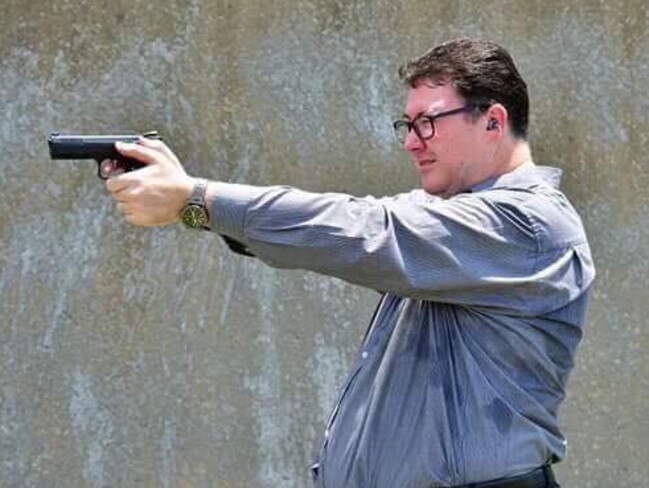 Photo from George Christensen MP's Facebook page of him shooting a handgun.