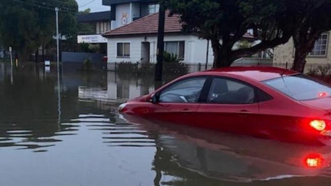 A car starnded in floodwaters in Richmond. Photo: NSW SES / Facebook