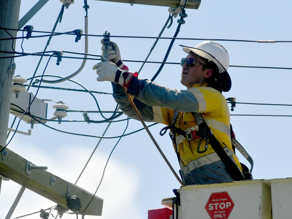 Ergon Engery workers restore power in Flower Street, Railway Estate after Cyclone Kirrily hit in January 2024. Picture: Evan Morgan