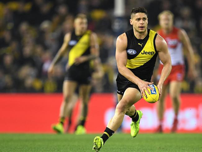 Dion Prestia of the Tigers is seen in action during the Round 15 AFL match between the Richmond Tigers and the Sydney Swans at Etihad Stadium in Melbourne, Thursday, June 28, 2018. (AAP Image/Julian Smith) NO ARCHIVING, EDITORIAL USE ONLY