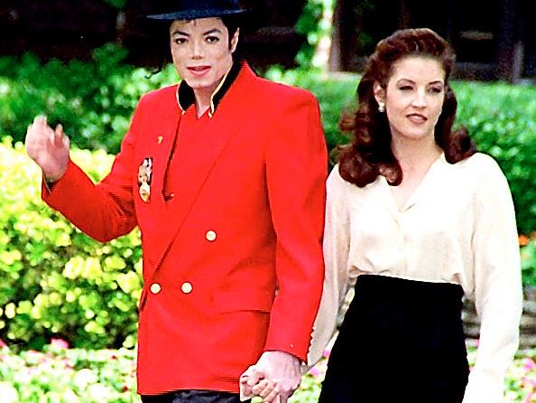 Strolling in the grounds of Neverland in 1995 with Lisa Marie Presley, who he married after a whirlwind romance the previous year. 