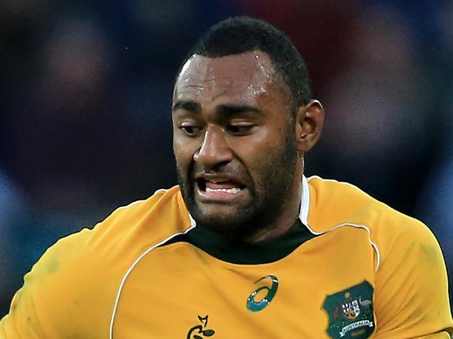 LONDON, ENGLAND - NOVEMBER 01: Tevita Kuridrani of Australia bursts past Dominic Bird (l) and Matias Alemanno (r) of the Barbarians during The Killik Cup match between the Barbarians and The Australian Wallabies at Twickenham Stadium on November 1, 2014 in London, England. (Photo by David Cannon/Getty Images)