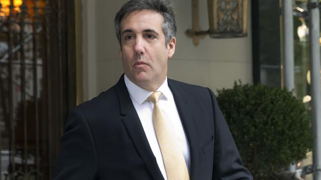 Michael Cohen leaves his apartment building on his way to court. Picture: AP.