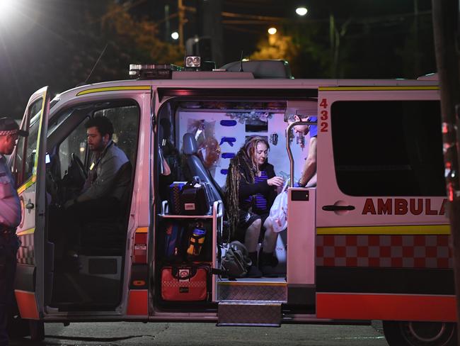 Victim Sharon Hacker in an ambulance after her attack by Evie Amati’s whose second axe blow could have killed. Picture: Gordon McComiskie