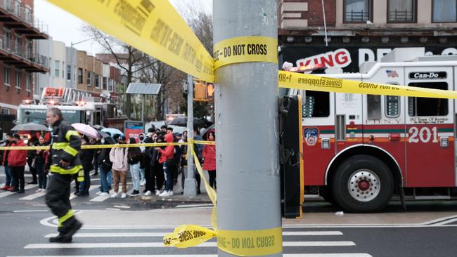 Police and emergency responders gather at the site of a reported shooting of multiple people outside the 36th St subway station on Tuesday in the Brooklyn borough of New York. Picture: AFP