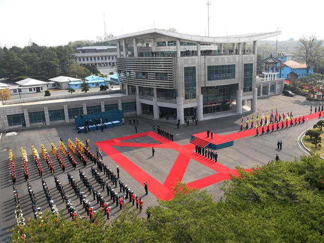 North Korea's leader Kim Jong Un and South Korea's President Moon Jae-in attend at a welcoming ceremony ahead of the inter-Korean summit at the truce village of Panmunjom. Picture: AFP