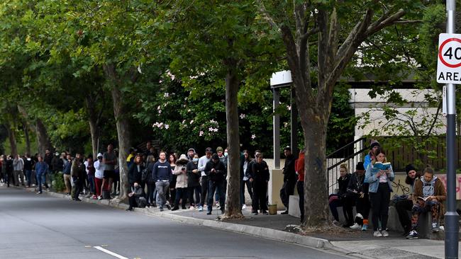 People are seen waiting in line at the Prahran Centrelink office in March. Picture: AAP