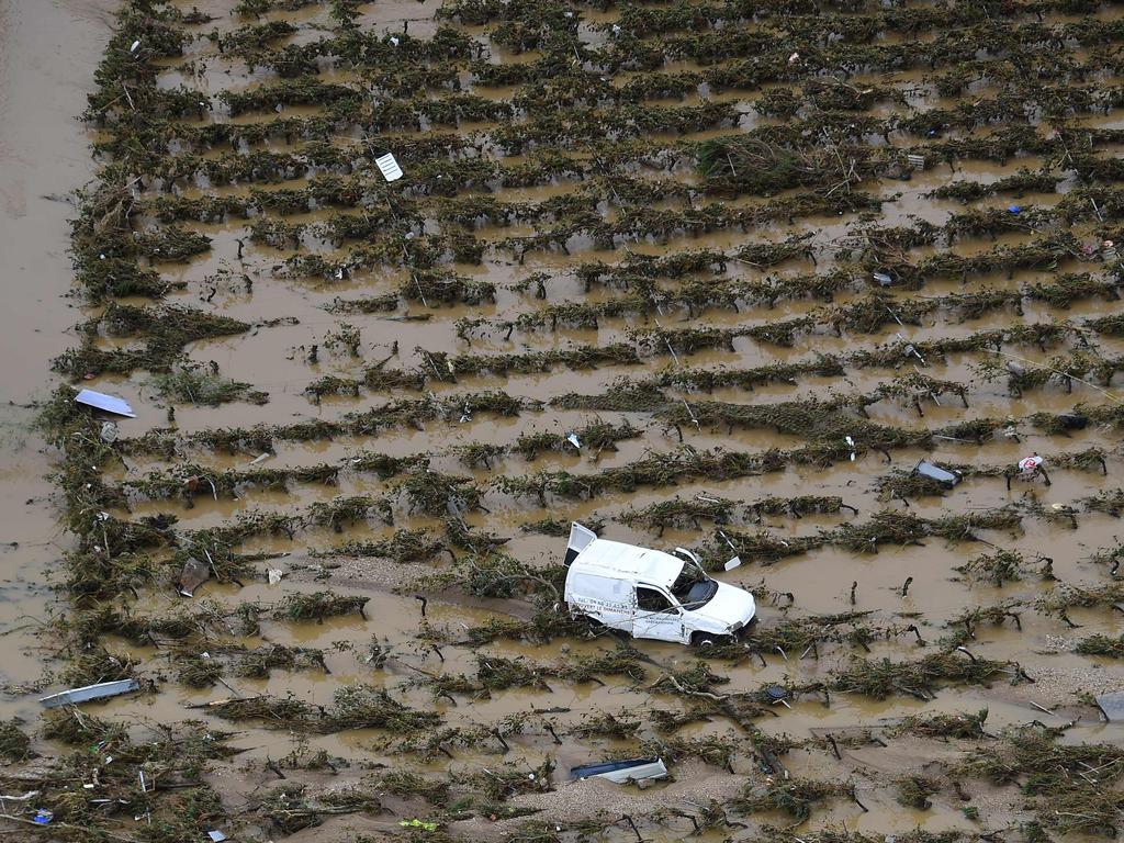 An aerial view shows a damaged car in a flooded field in the city of Villegailhenc, near Carcassonne, southern France. Picture: AFP