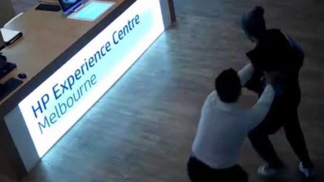 Mr Maskell and his attacker scuffle inside the store.