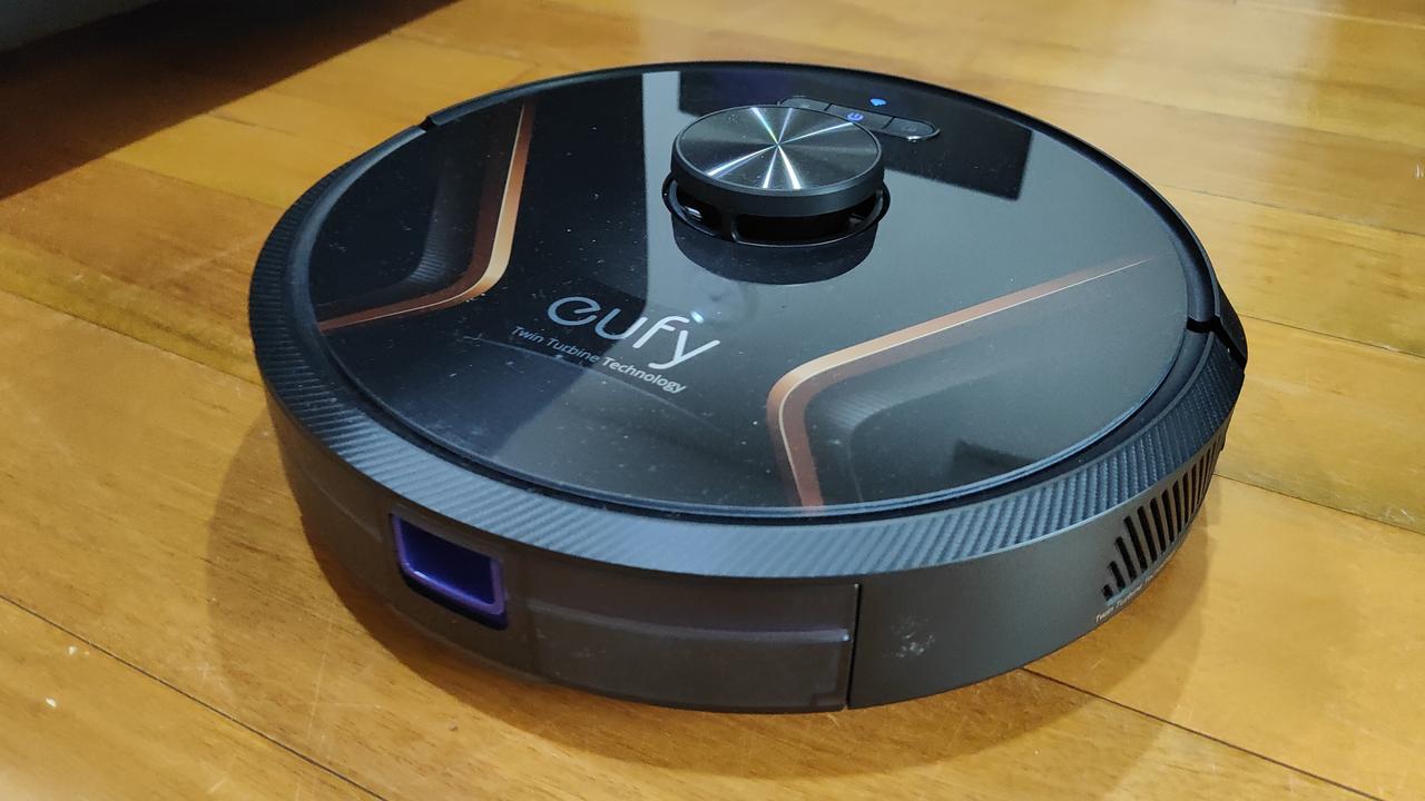 The Eufy X8 Hybrid RoboVac roving around my unit — hunting dirt. Picture: Andrew Backhouse