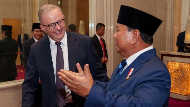 Indonesian President Prabowo Subianto greets Prime Minister Anthony Albanese in Jakarta.