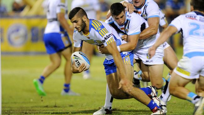 Parramatta Eels young gun Alex Twal fights for that end line against the Titans.