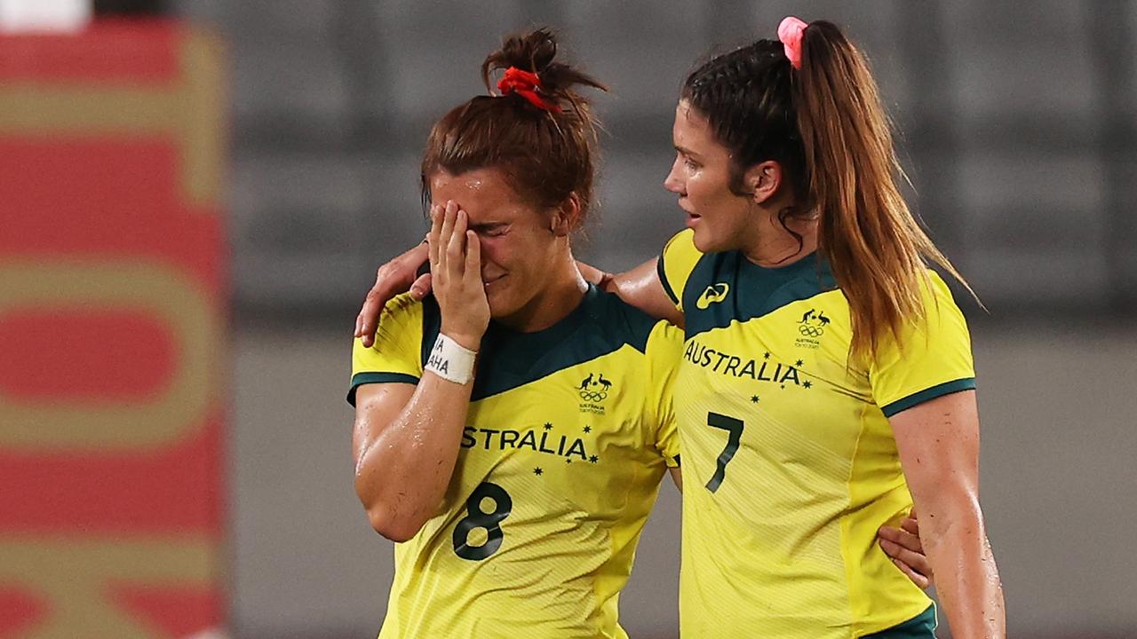 A shattered Madison Ashby (L) with Charlotte Caslick at the Olympic Games. Pic: Dan Mullan/Getty Images)