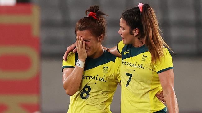 A shattered Madison Ashby (L) with Charlotte Caslick at the Olympic Games. Pic: Dan Mullan/Getty Images)