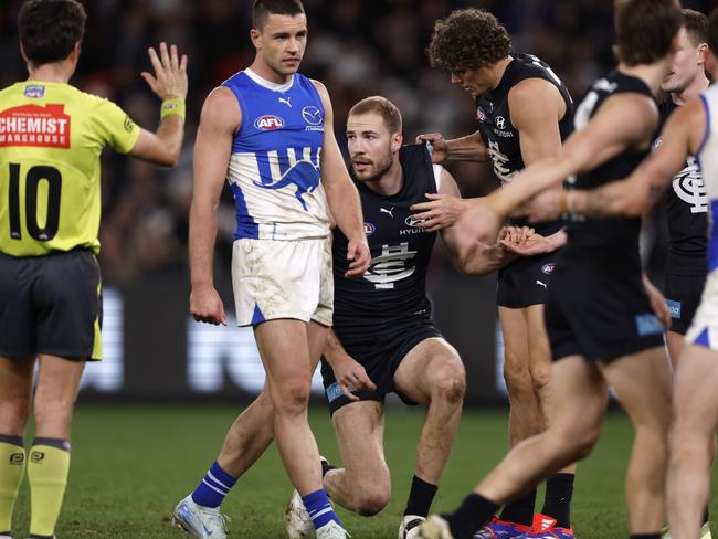 Harry McKay is helped to his feet after a heavy hit. Picture: Getty Images