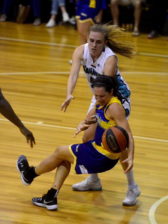 Queensland Basketball League quarter finals at Townsville Basketball Stadium. Townsville Flames against North Gold Coast Seahawks. Seahawks' Lauren Jansen fights for the ball with Flames' Micaela Cocks. Picture: Evan Morgan