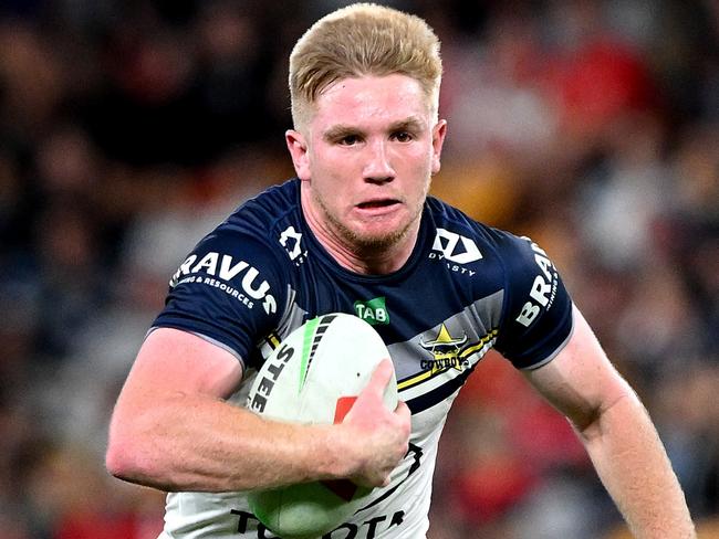 Tom Dearden of the Cowboys breaks away from the defence during the round 26 NRL match between Dolphins and North Queensland Cowboys. Picture: Bradley Kanaris/Getty Images