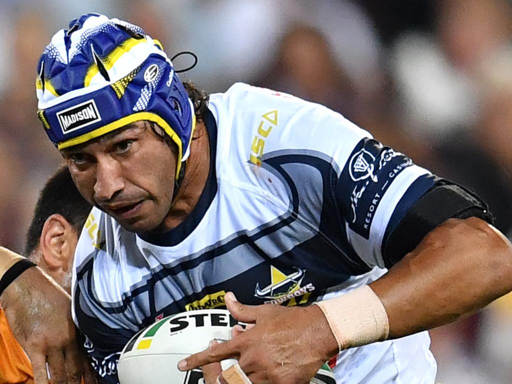 Johnathan Thurston (right) of the Cowboys in action during the Round 2 NRL match between the Brisbane Broncos and the North Queensland Cowboys at Suncorp Stadium in Brisbane, Friday, March 16, 2018. (AAP Image/Darren England) NO ARCHIVING, EDITORIAL USE ONLY