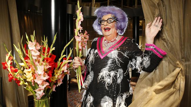 Barry Humphries as Dame Edna Everage with her favourite gladiolas. Picture: David Caird