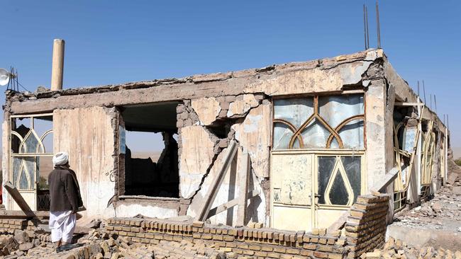 An Afghan man stands near a damaged house after the earthquakes in Sarbuland village, Zendeh Jan district of Herat province. Picture: AFP