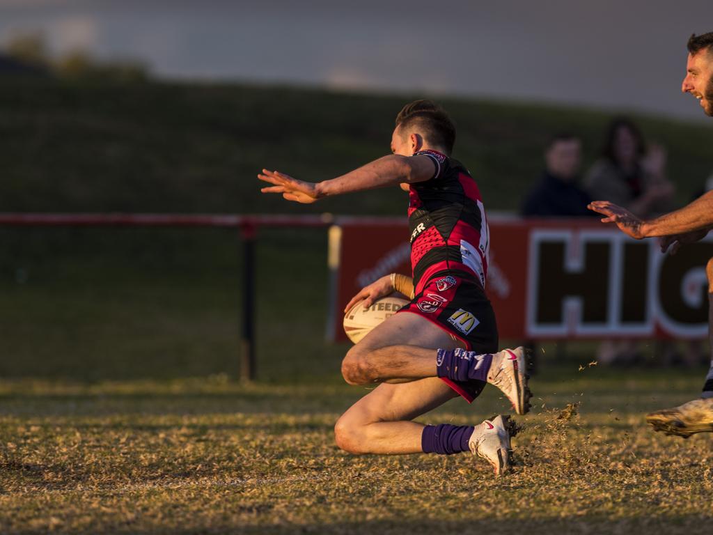 Harrison Burns gets over to try for Valleys under pressure from Dylan Adamson of Oakey in TRL A grade round 10 rugby league at Herb Steinohrt Oval, Sunday, June 20, 2021. Picture: Kevin Farmer